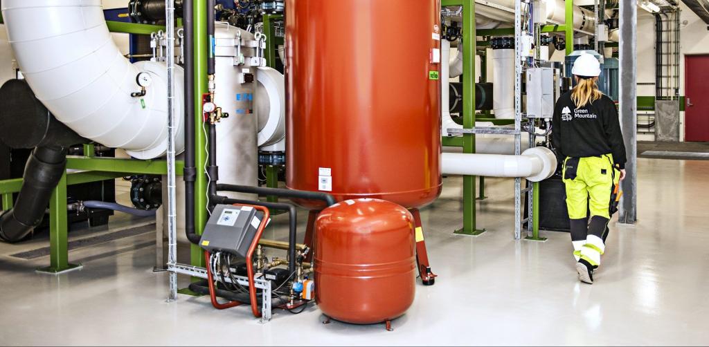 Data Center Technician inside cooling station.